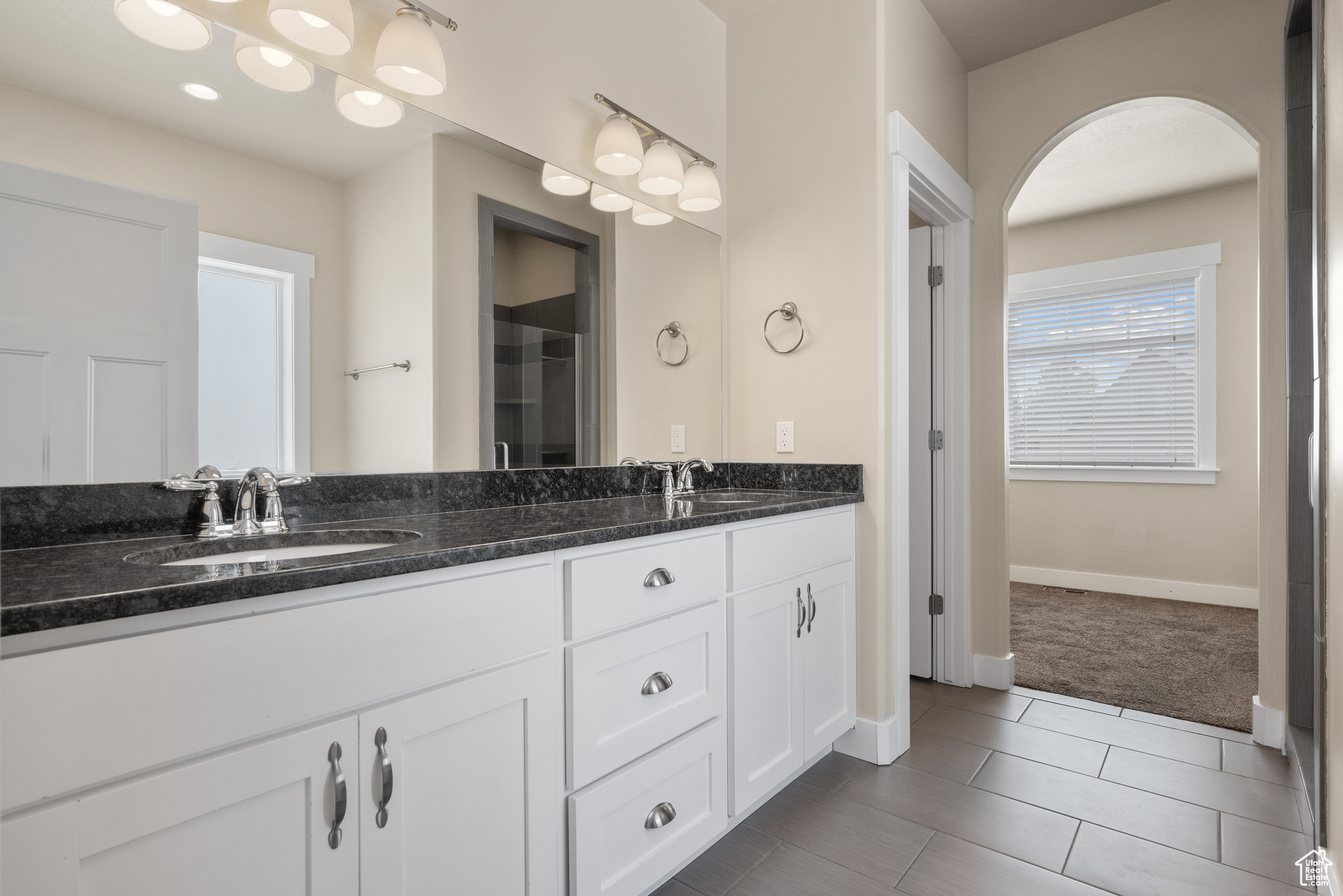 Bathroom with vanity and tile patterned flooring