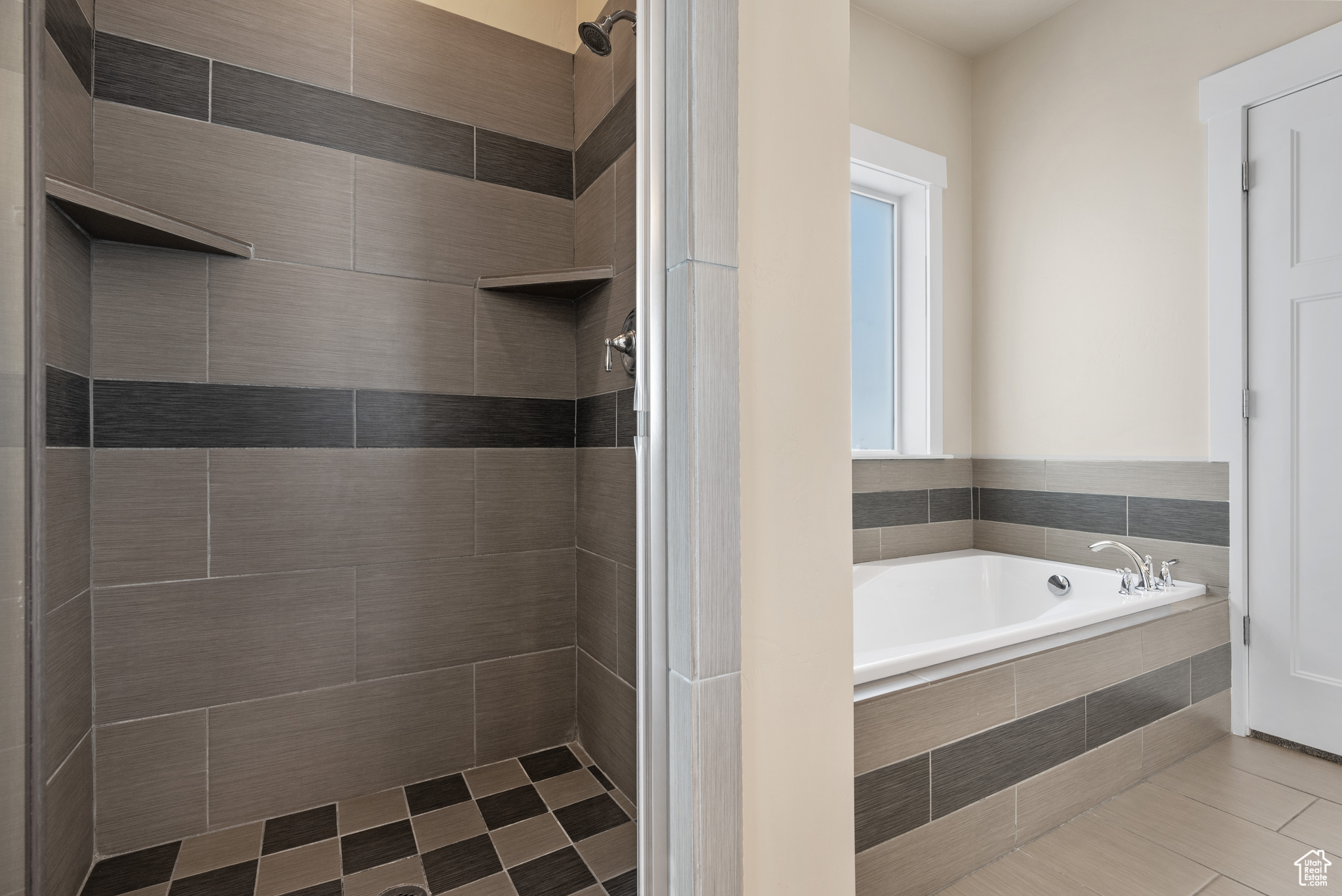 Bathroom with tile patterned flooring and separate shower and tub