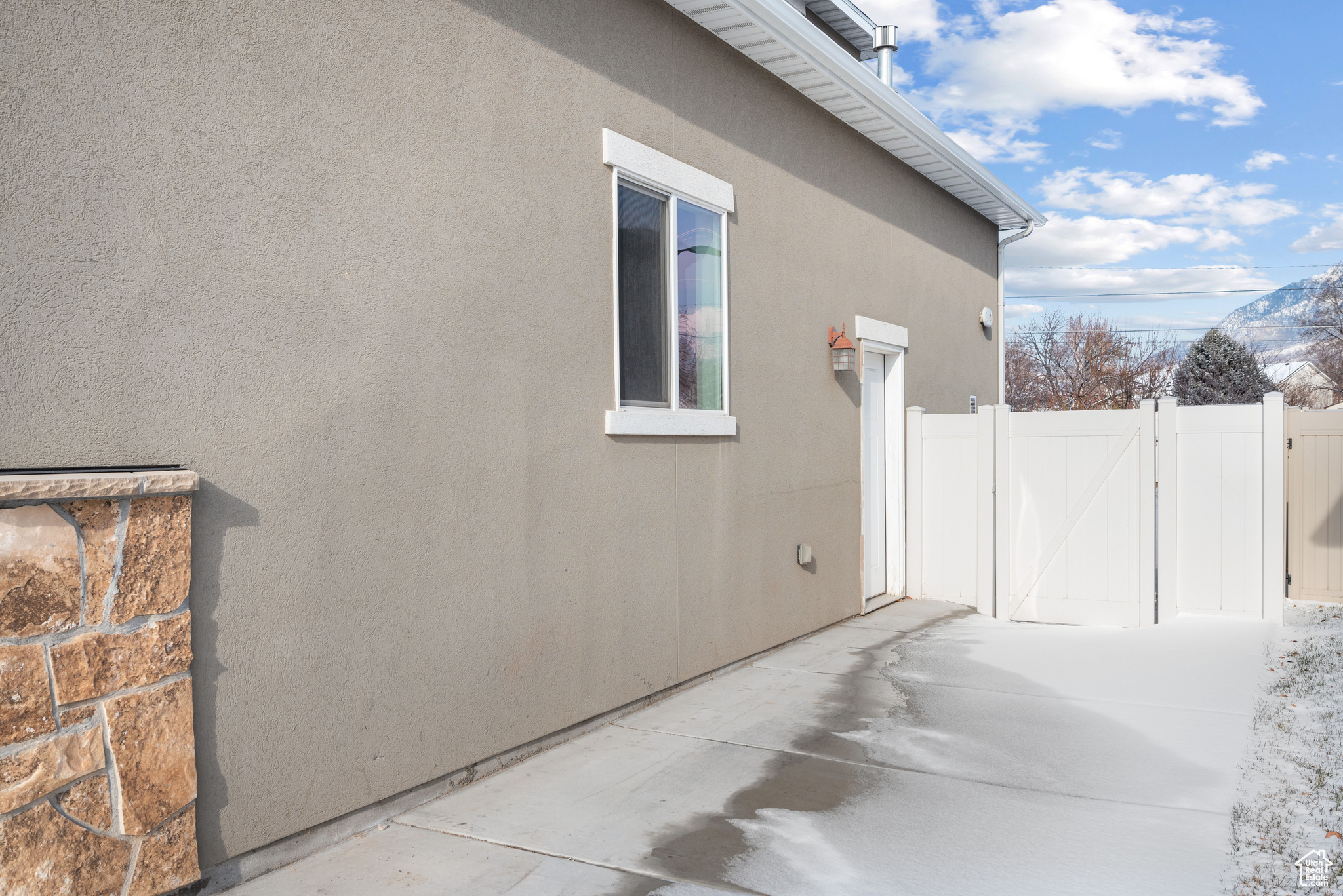 View of property exterior featuring a patio