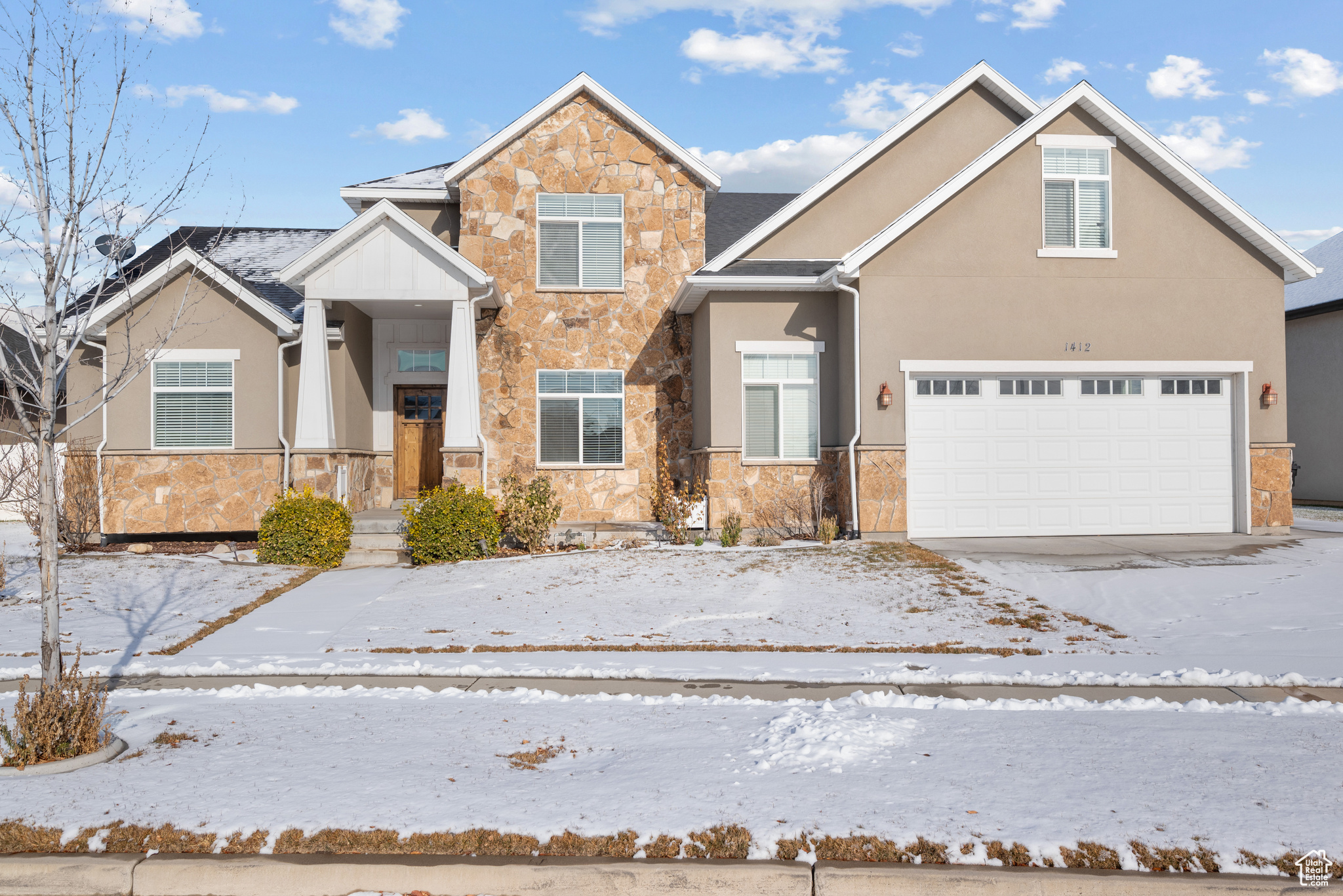 Front of property with a garage