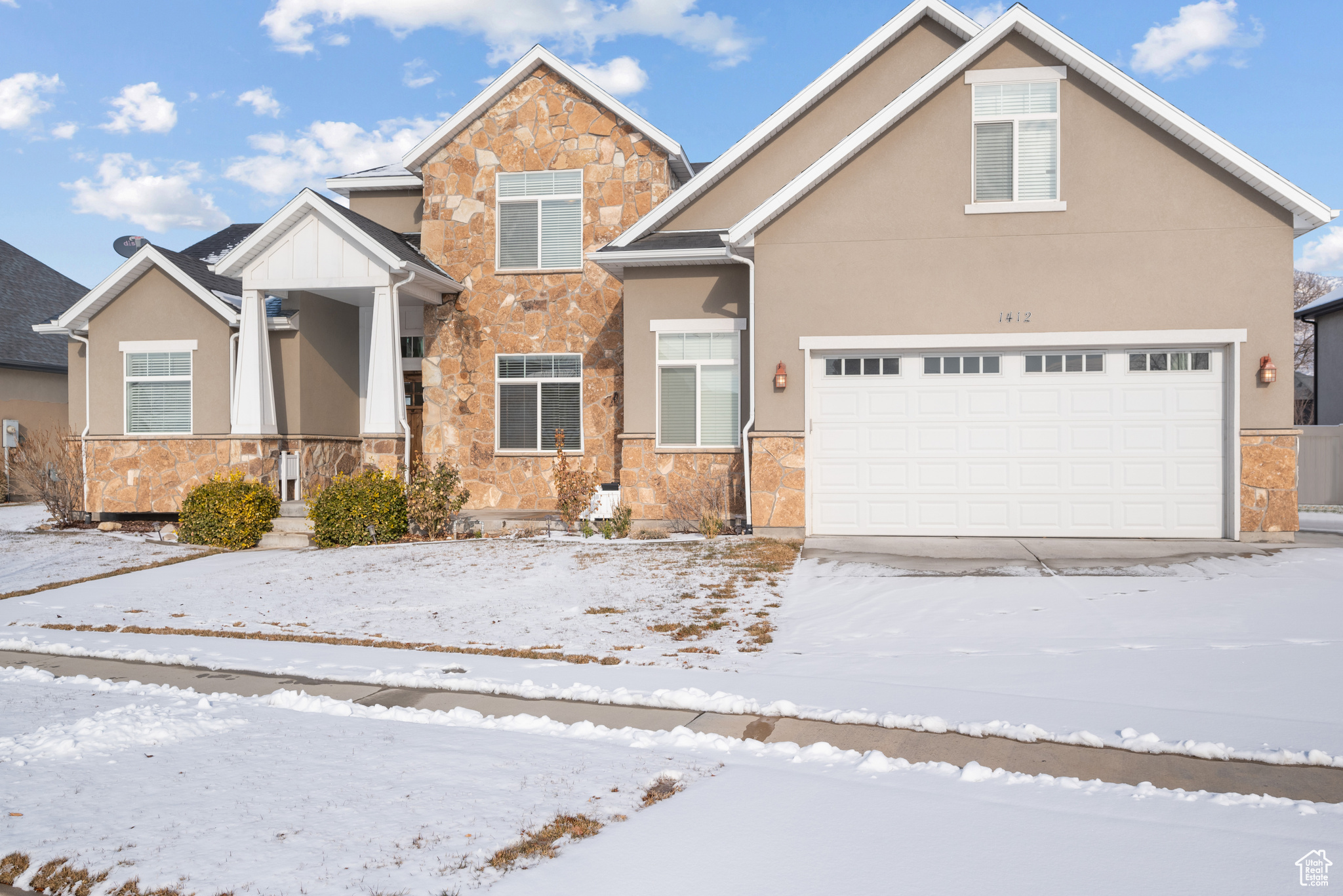 View of front of property featuring a garage