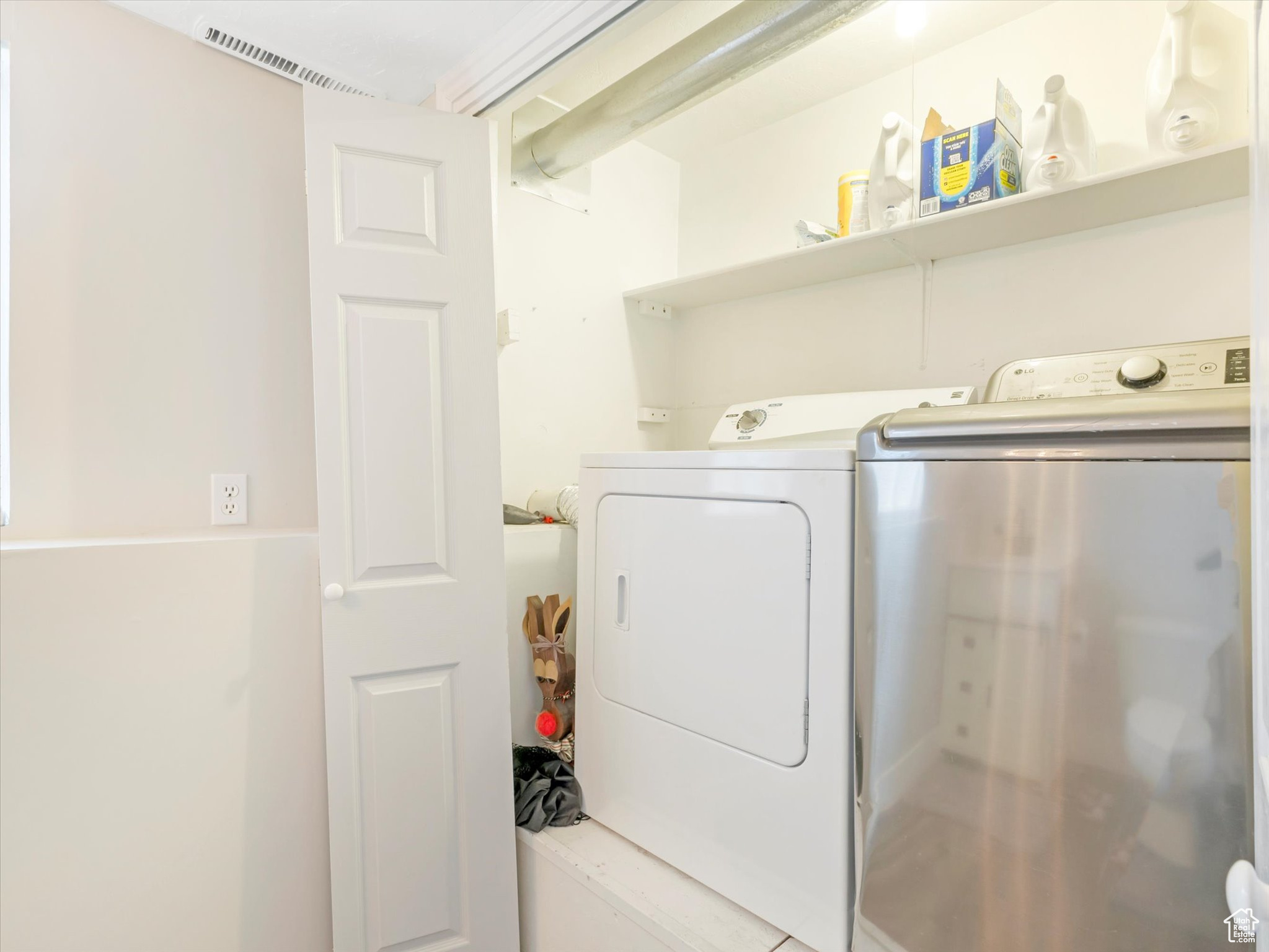 Laundry room featuring separate washer and dryer