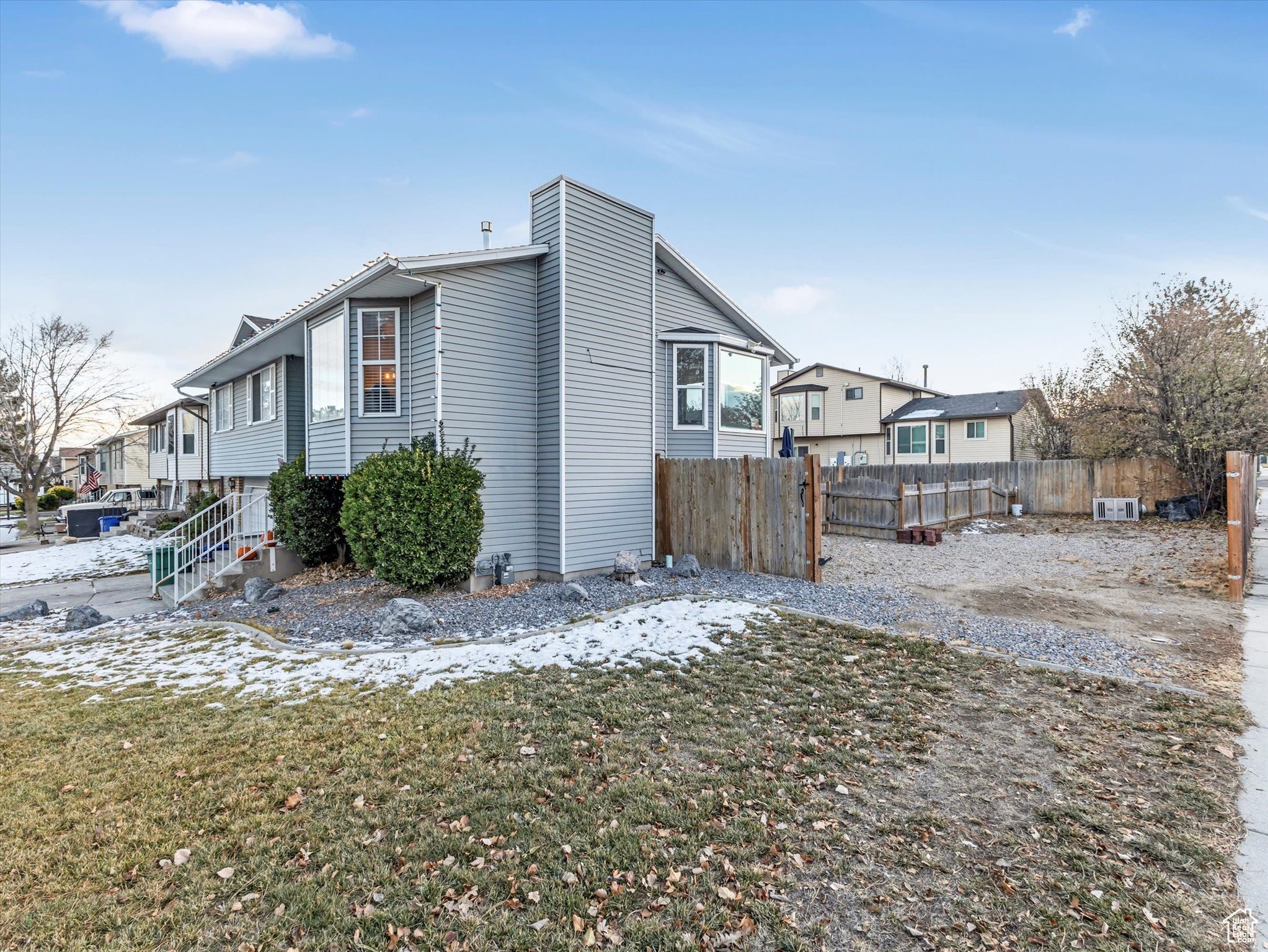 View of snowy exterior featuring a yard