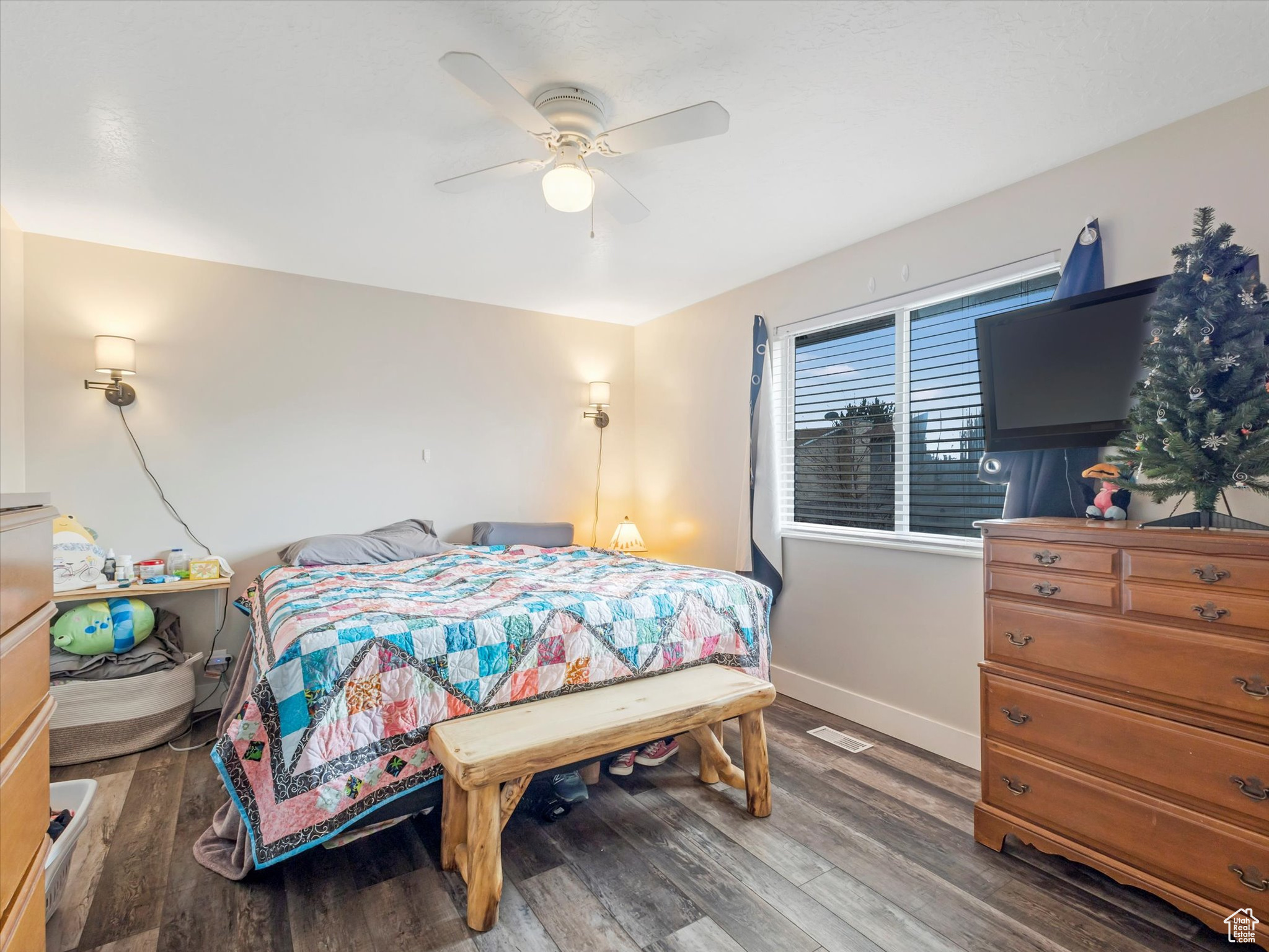 Bedroom featuring hardwood / wood-style floors and ceiling fan