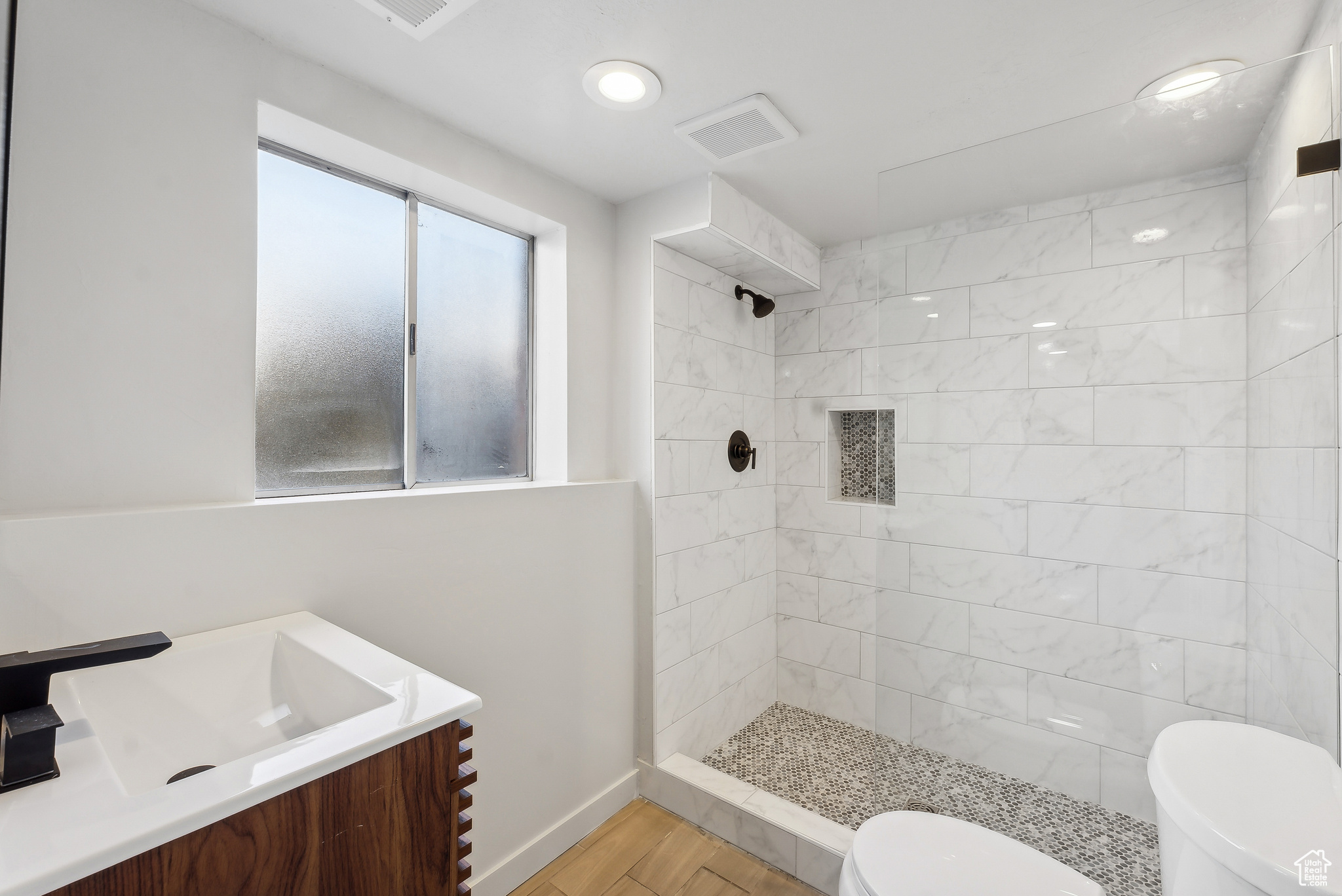 ensuite, custom tiled shower, floating vanity