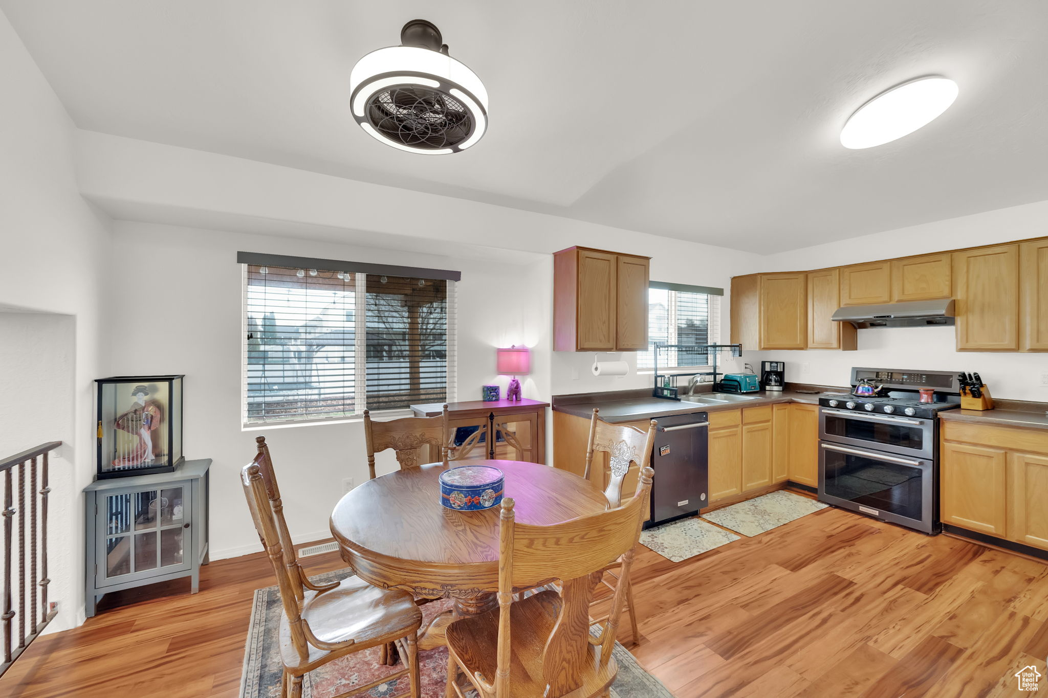 Kitchen featuring light hardwood / wood-style flooring, stainless steel appliances, and sink