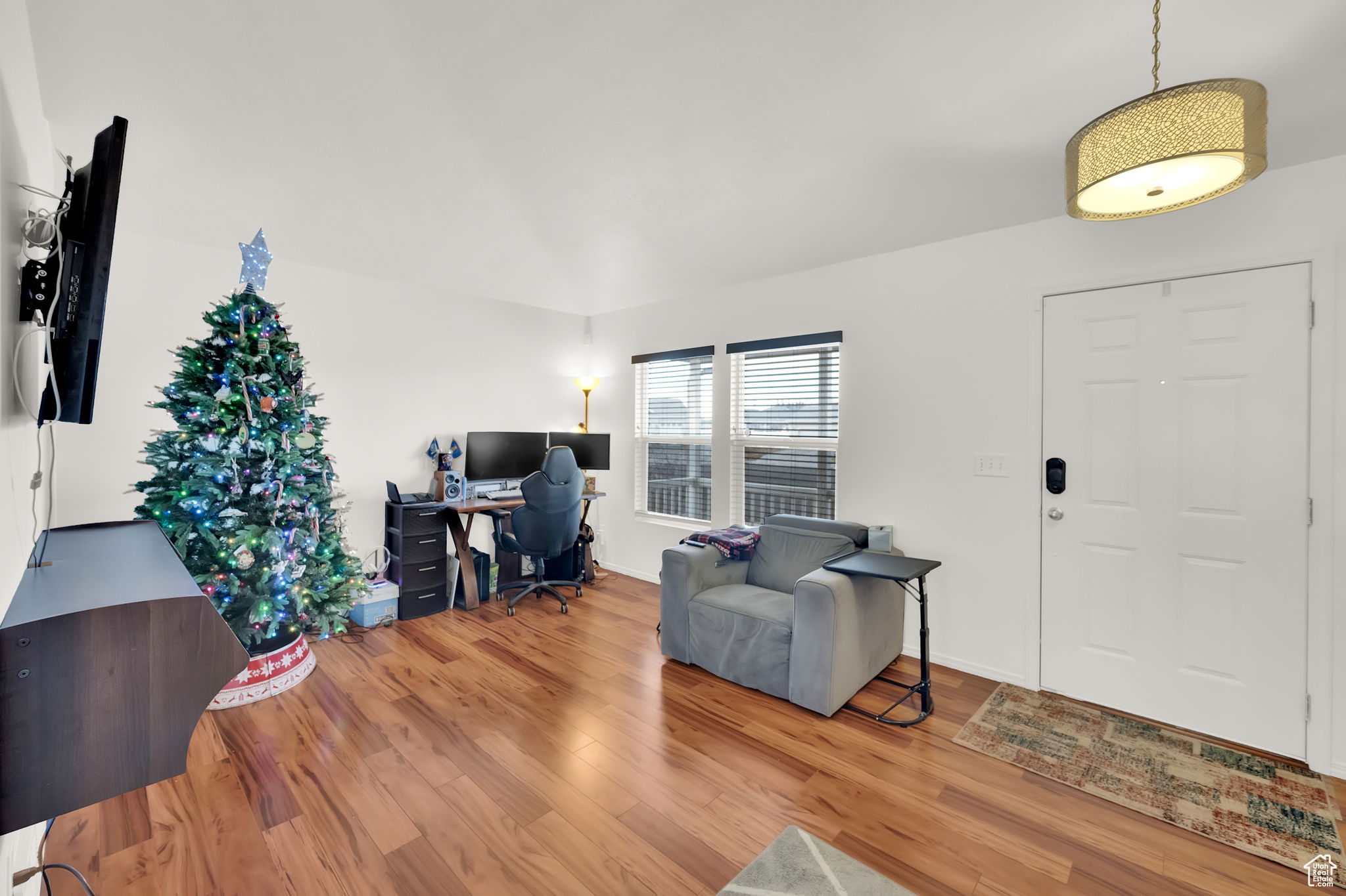 Entrance foyer with hardwood / wood-style floors