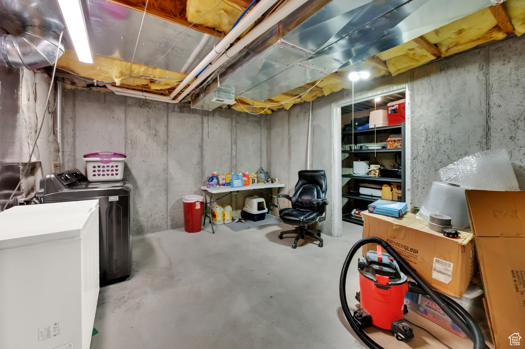 Basement featuring washer and clothes dryer