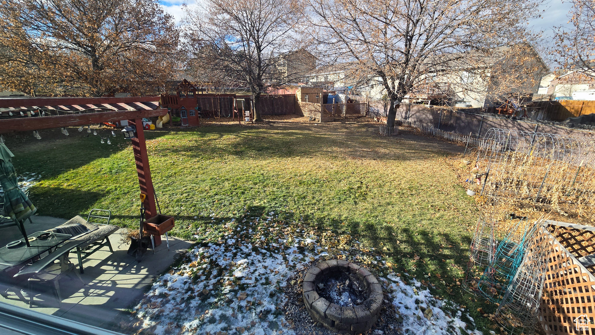 View of yard featuring an outdoor fire pit and a patio