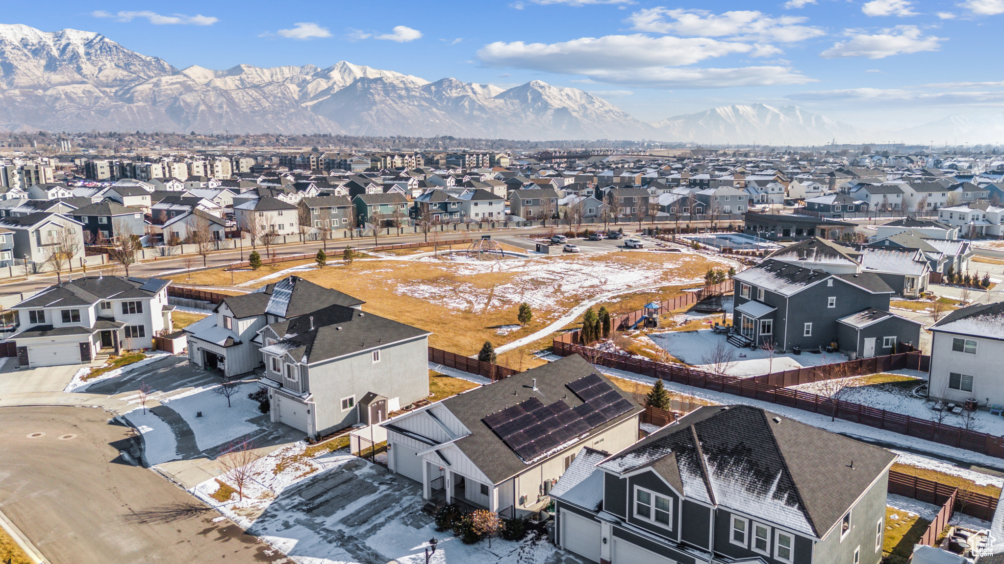 Snowy aerial view featuring a mountain view