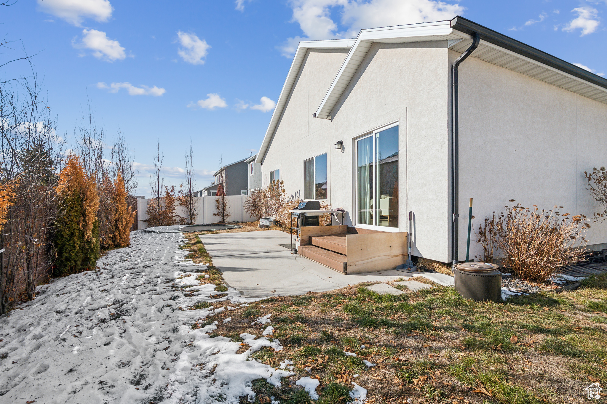 View of side of home featuring a patio