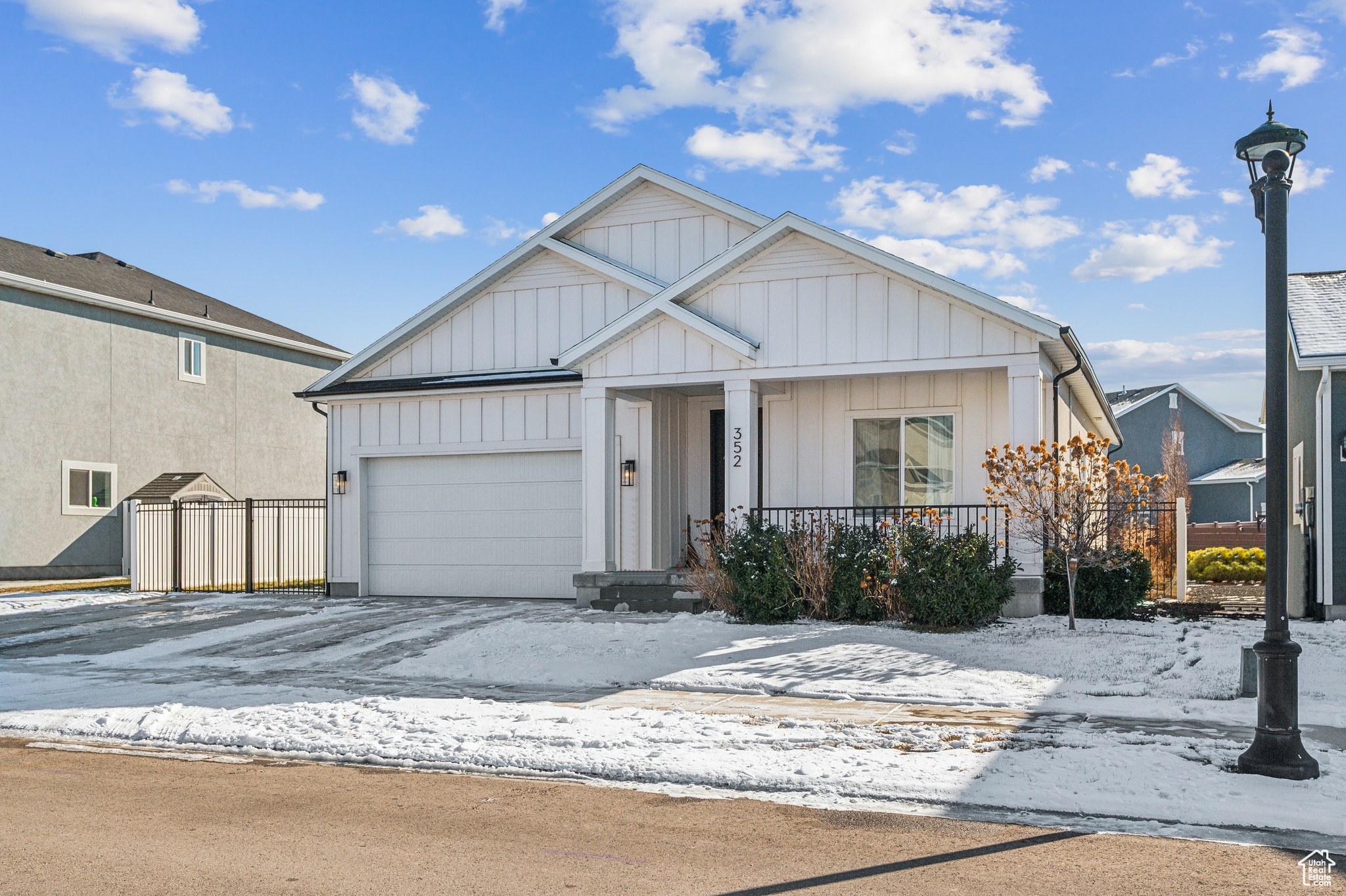 View of front of house with a garage and covered porch