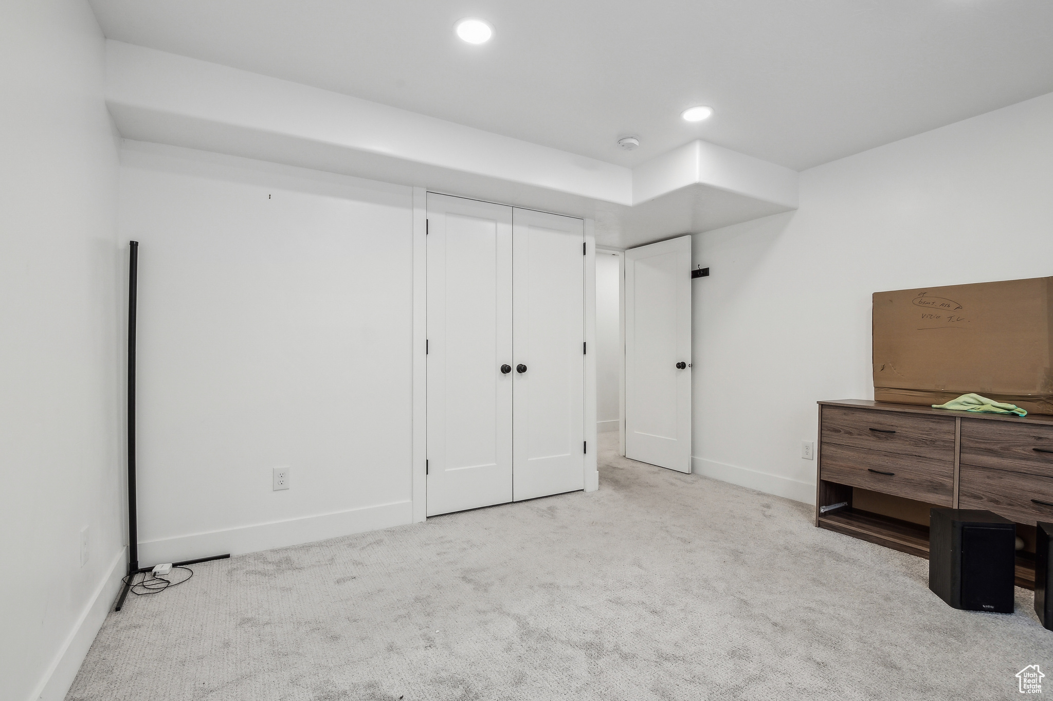 Bedroom with light carpet