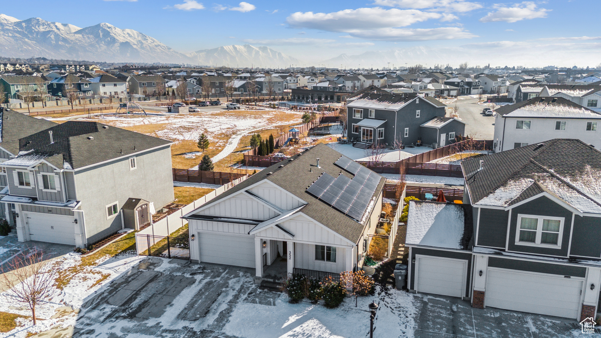 Snowy aerial view featuring a mountain view