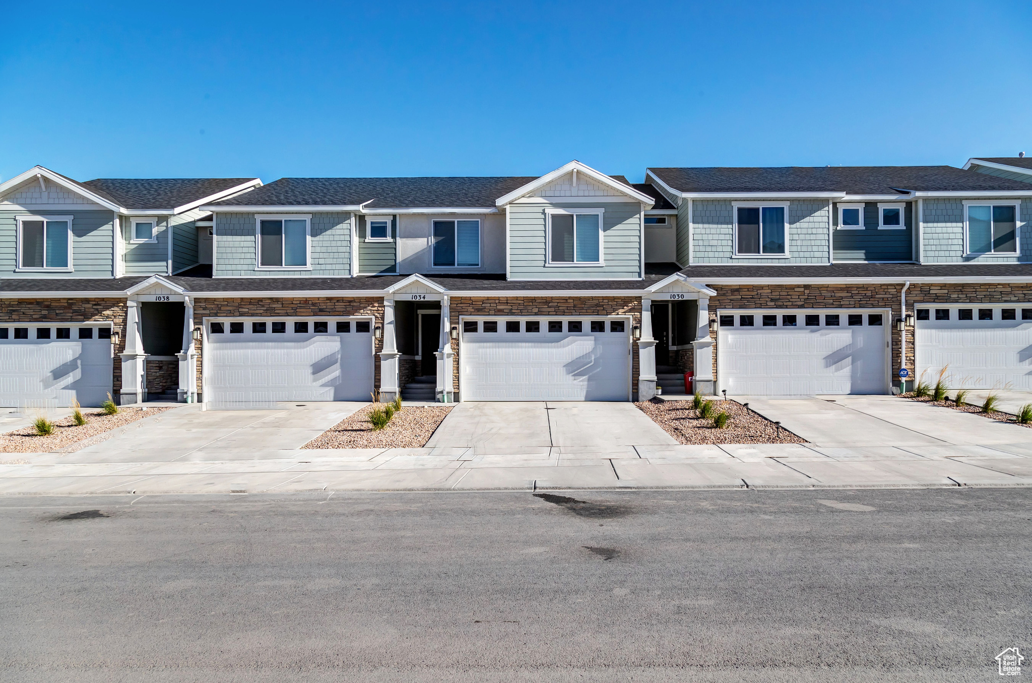 Townhome / multi-family property featuring a garage