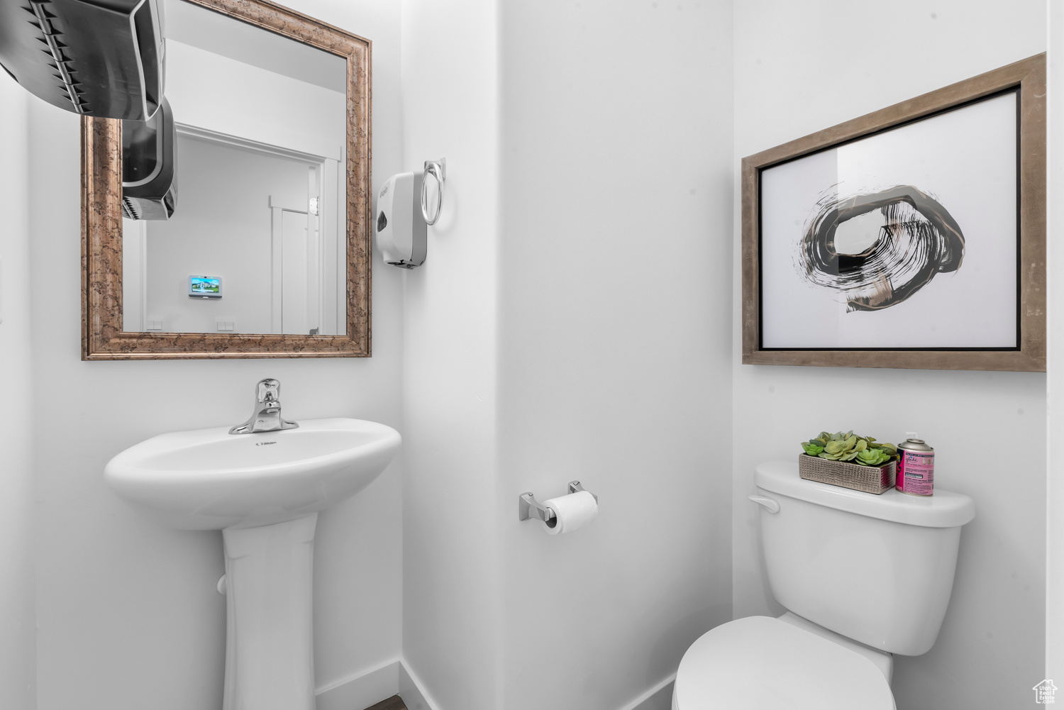 Bathroom featuring sink and toilet