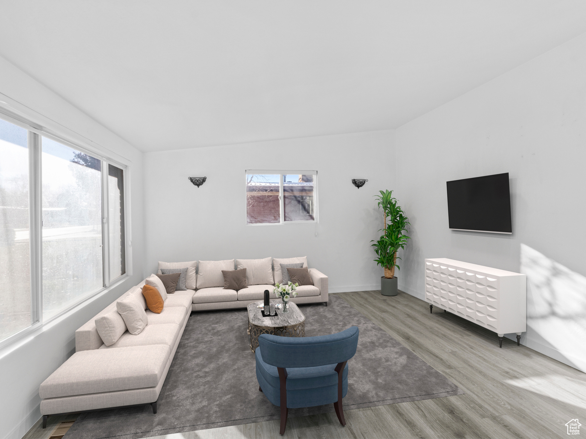 Living room with hardwood / wood-style floors and a wealth of natural light