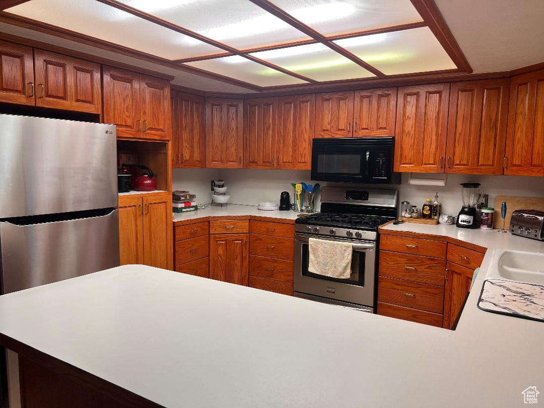 Kitchen with appliances with stainless steel finishes