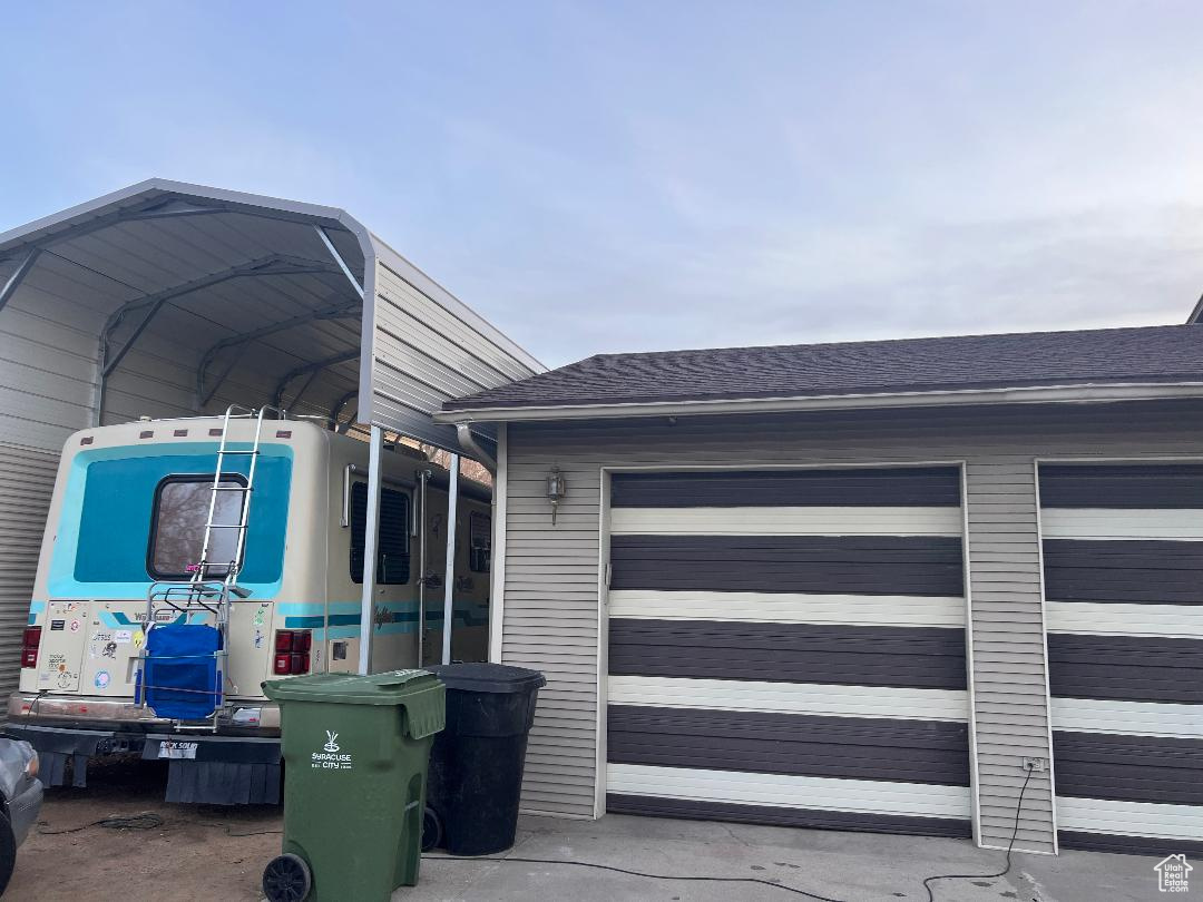 Exterior space featuring a carport