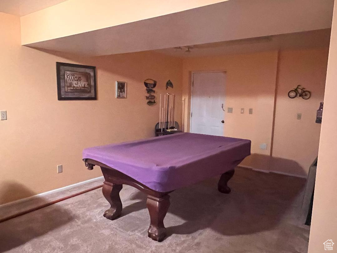 Recreation room with carpet floors and pool table