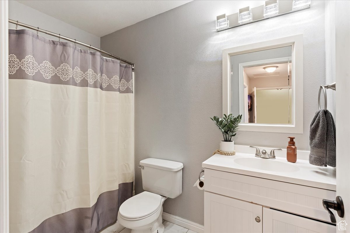 Bathroom featuring vanity and toilet