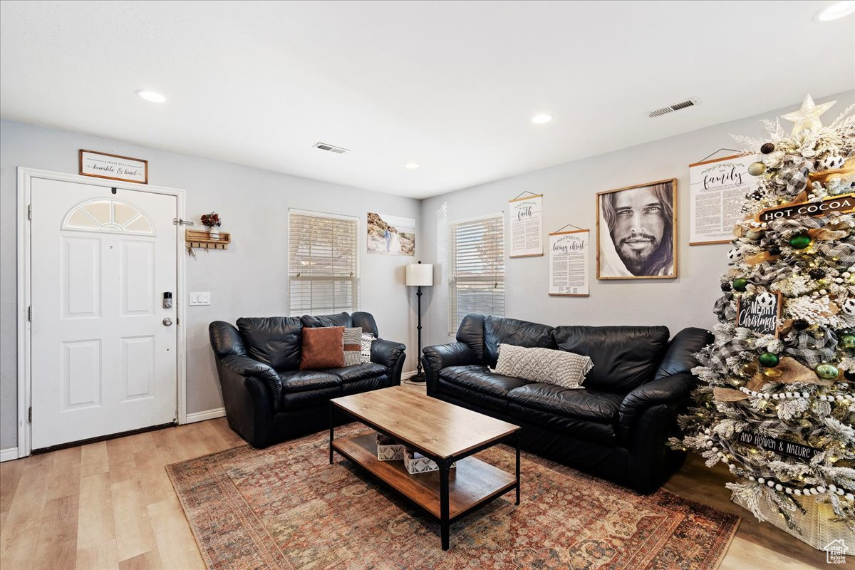 Living room with light wood-type flooring