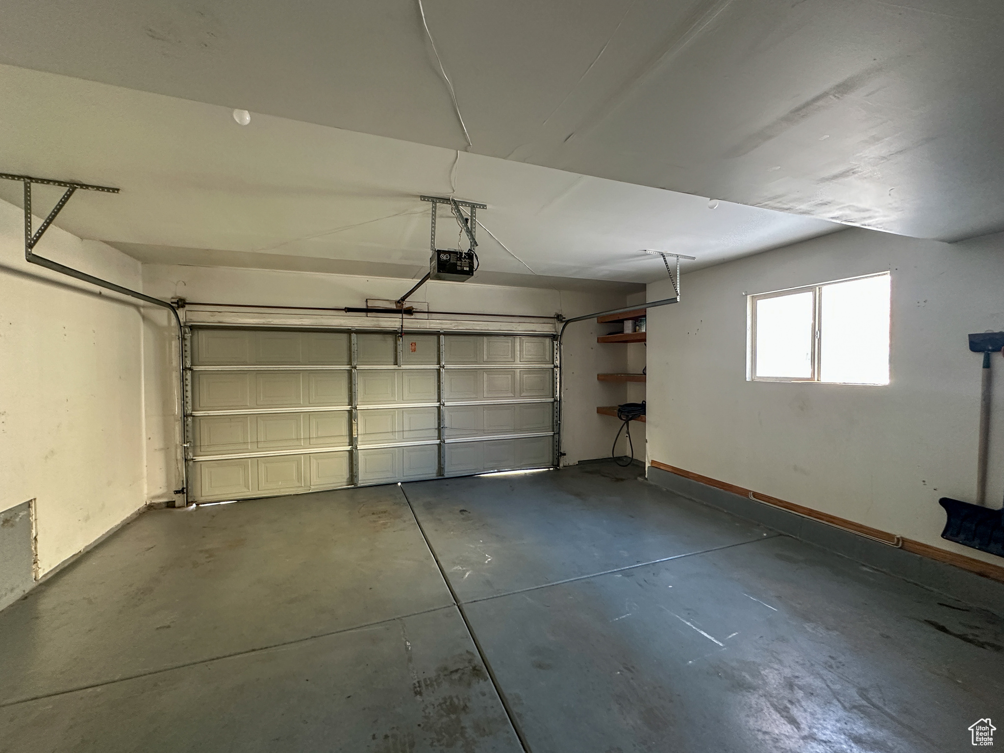 Garage featuring a garage door opener