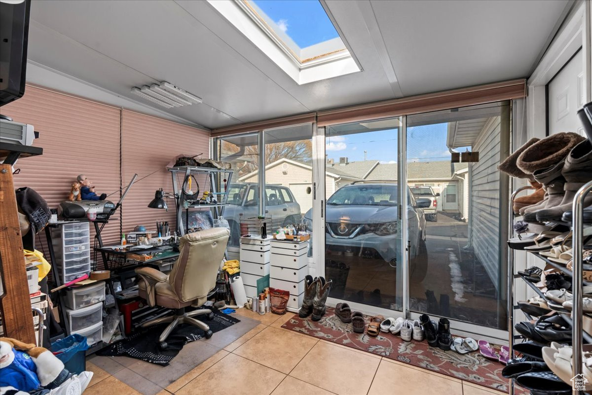 Tiled home office with a skylight