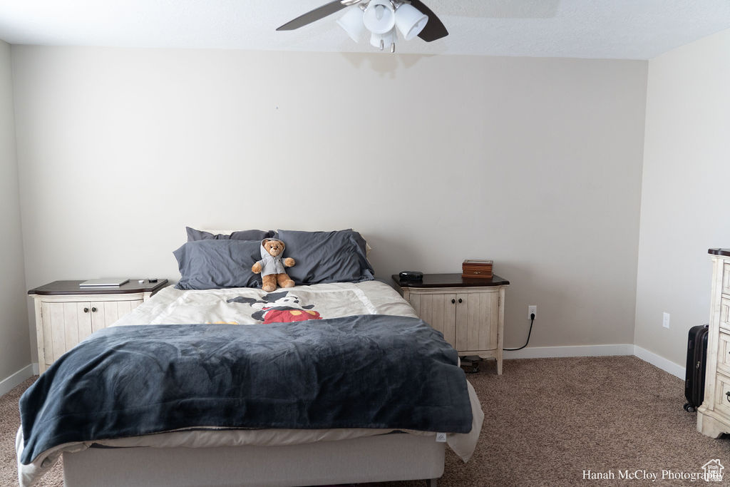 Bedroom with carpet and ceiling fan