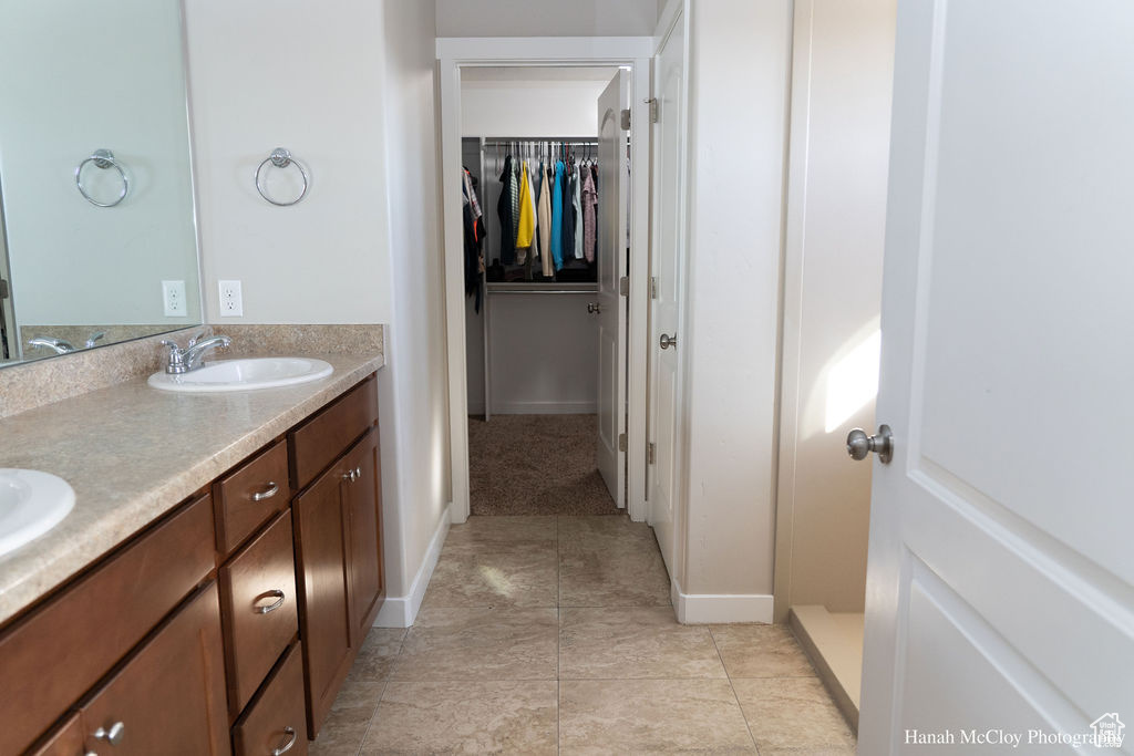 Bathroom featuring tile patterned floors and vanity