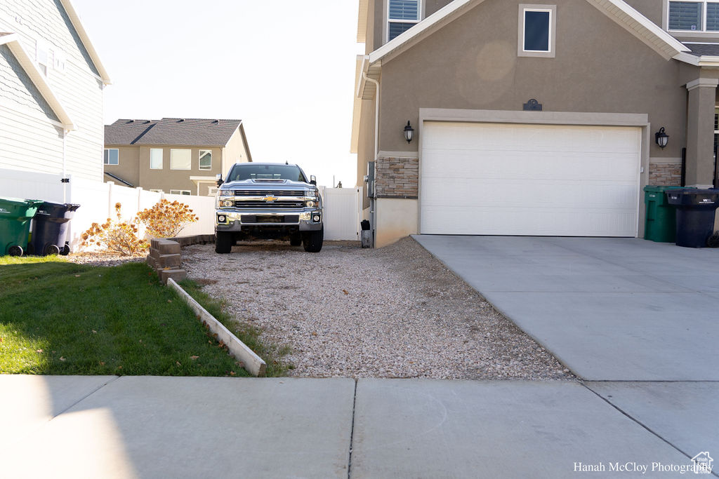 View of property exterior with a garage