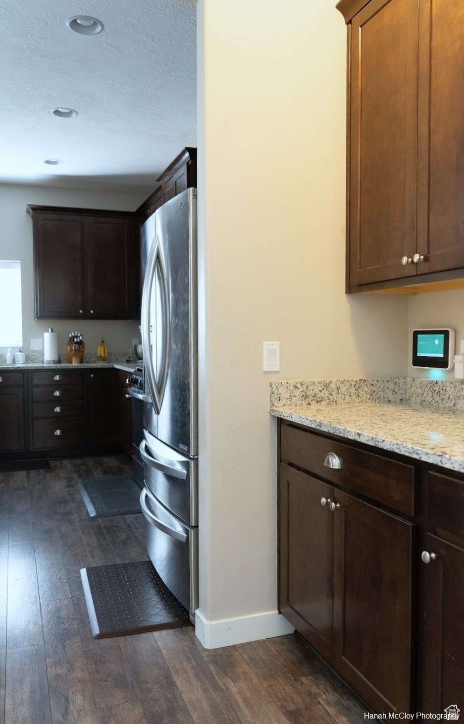 Laundry area featuring dark hardwood / wood-style floors