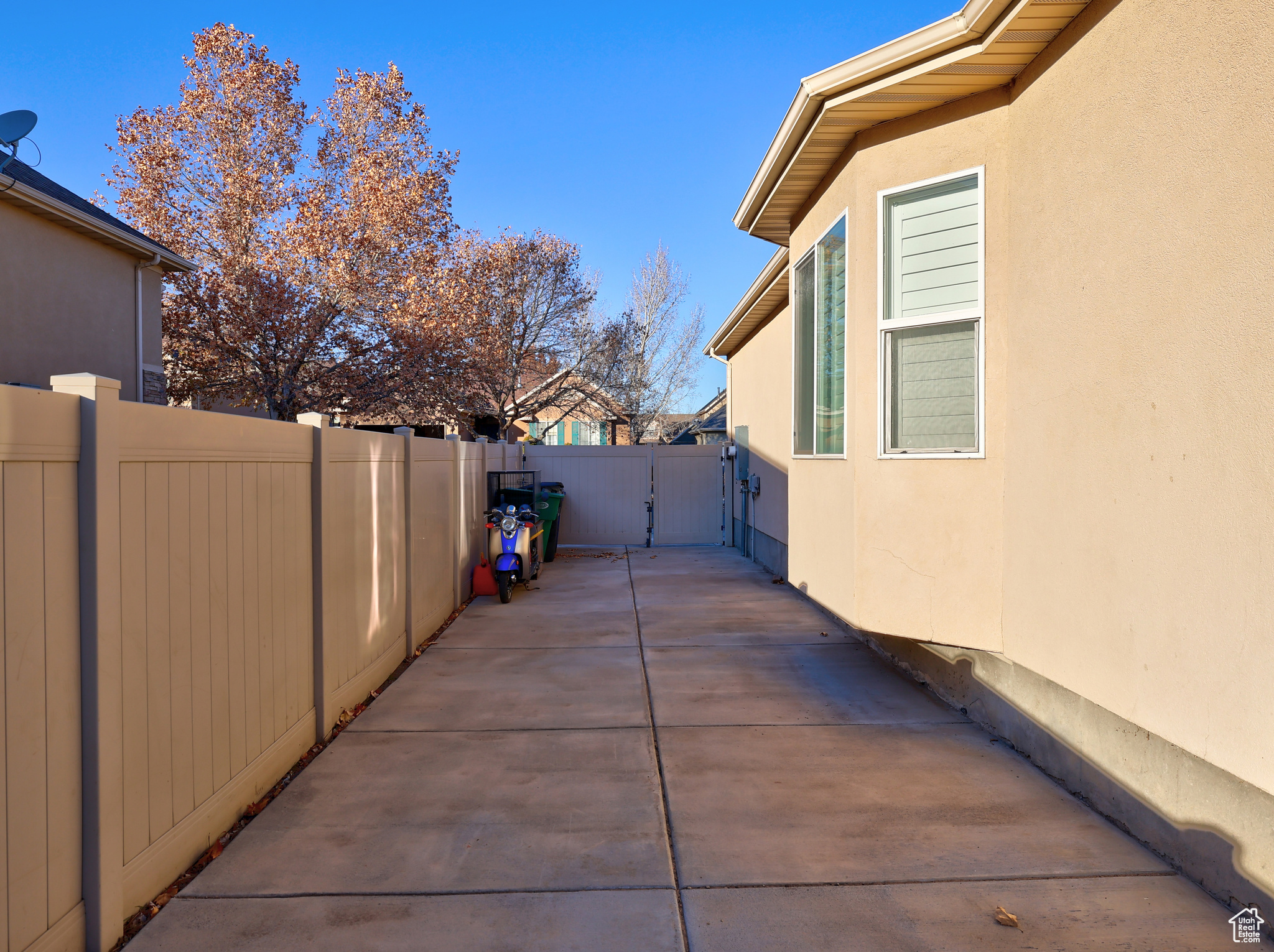 View of side of property with a patio