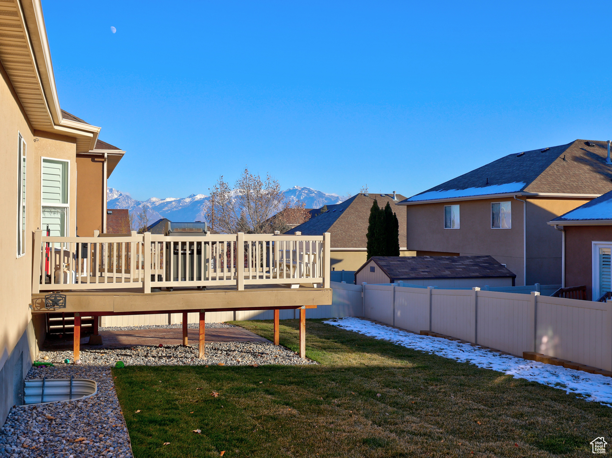 View of yard featuring a deck with mountain view