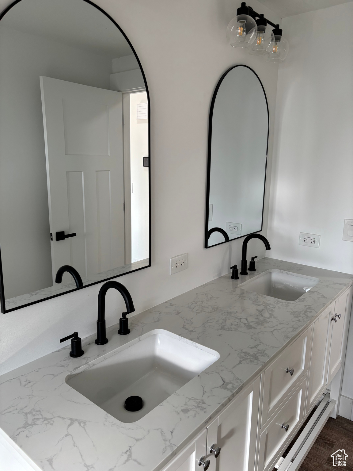 Bathroom with vanity and wood-type flooring