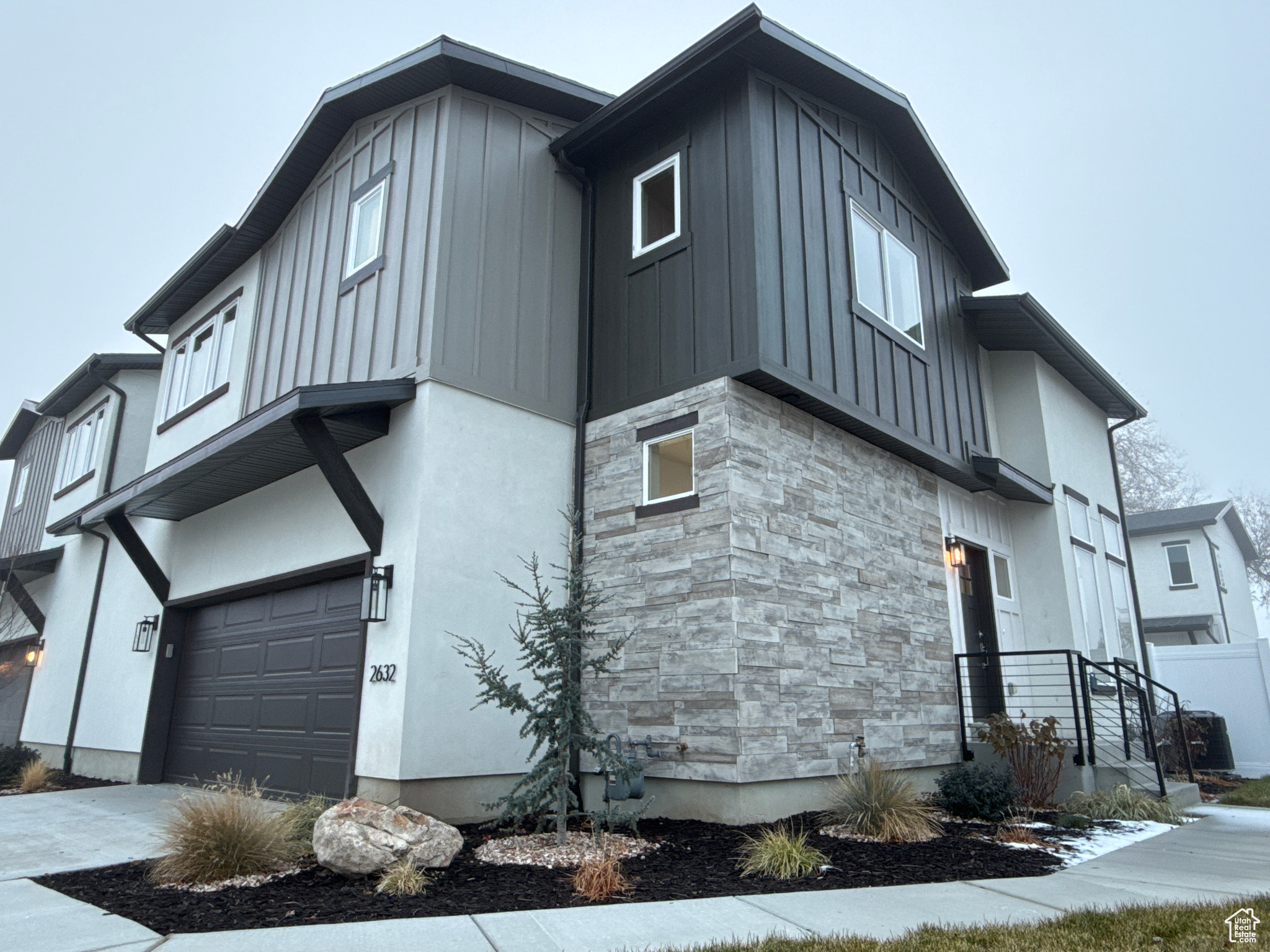 View of property exterior featuring a garage