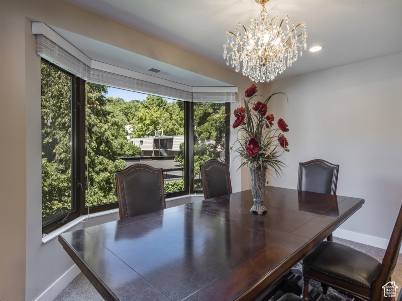 Dining space featuring an inviting chandelier