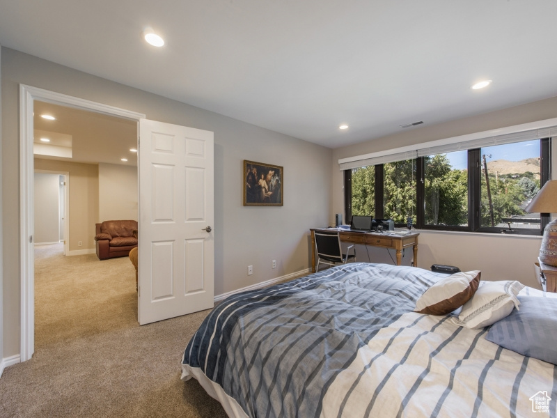 Bedroom with light carpet