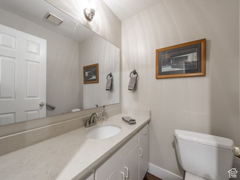 Bathroom featuring vanity and toilet