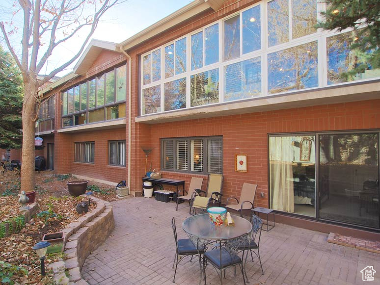 Rear view of house featuring a patio