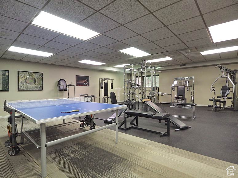 Exercise room featuring a drop ceiling