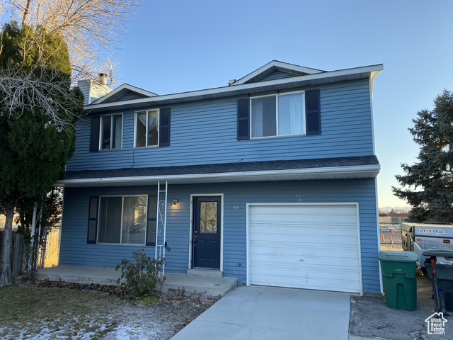 Front of property featuring a garage