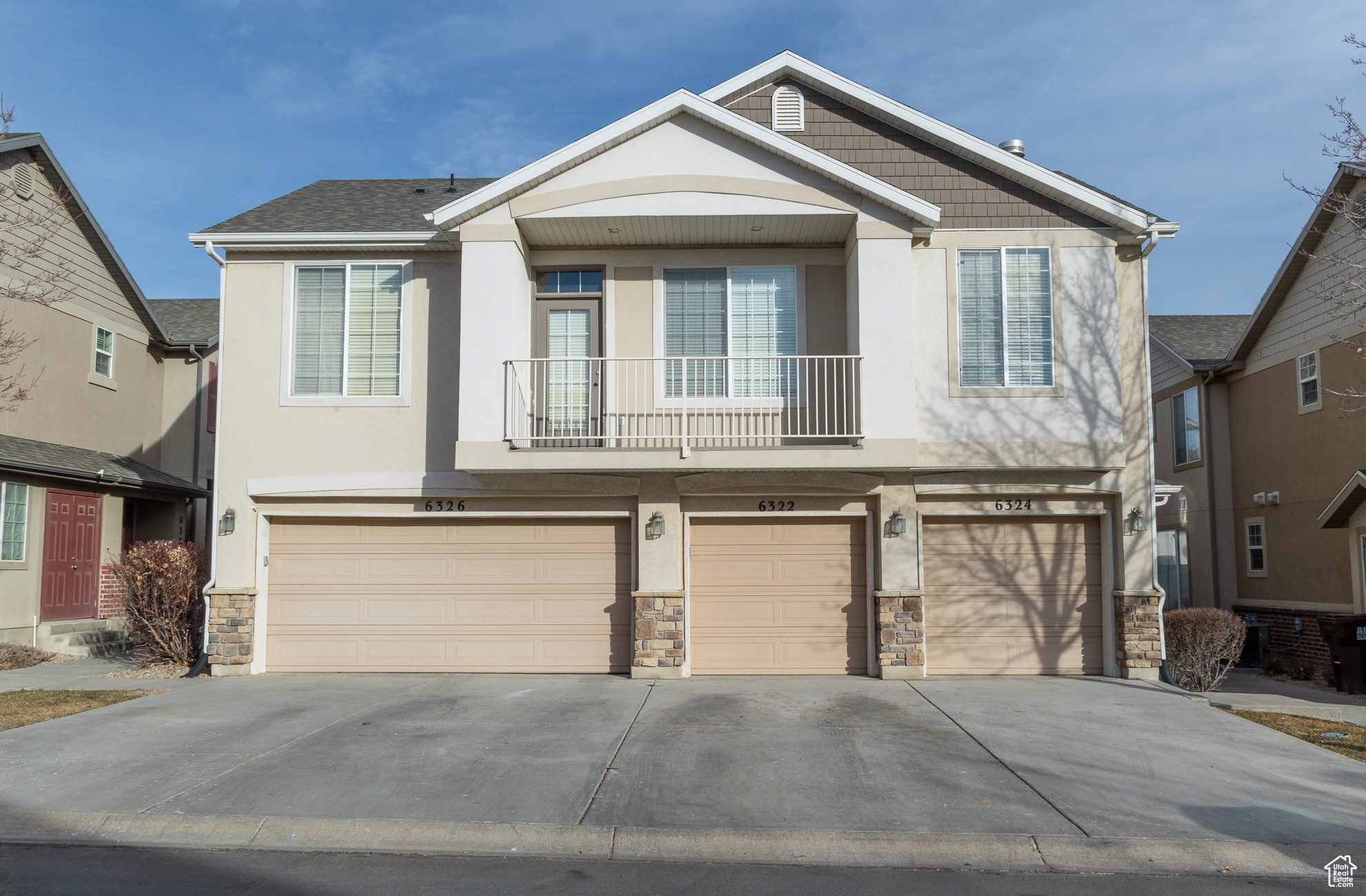 View of front of home featuring a balcony