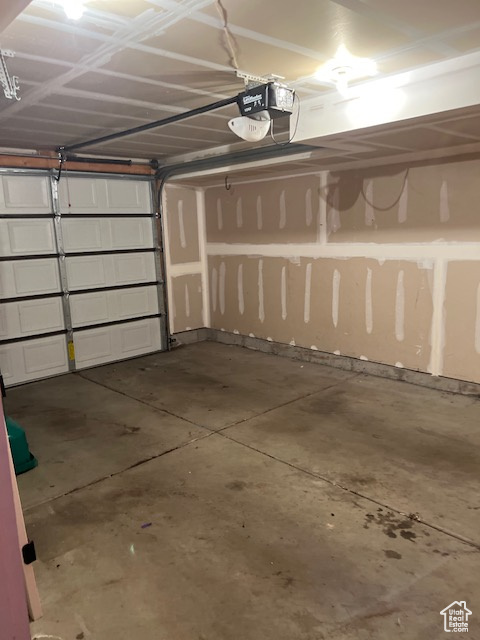 Garage featuring a garage door opener