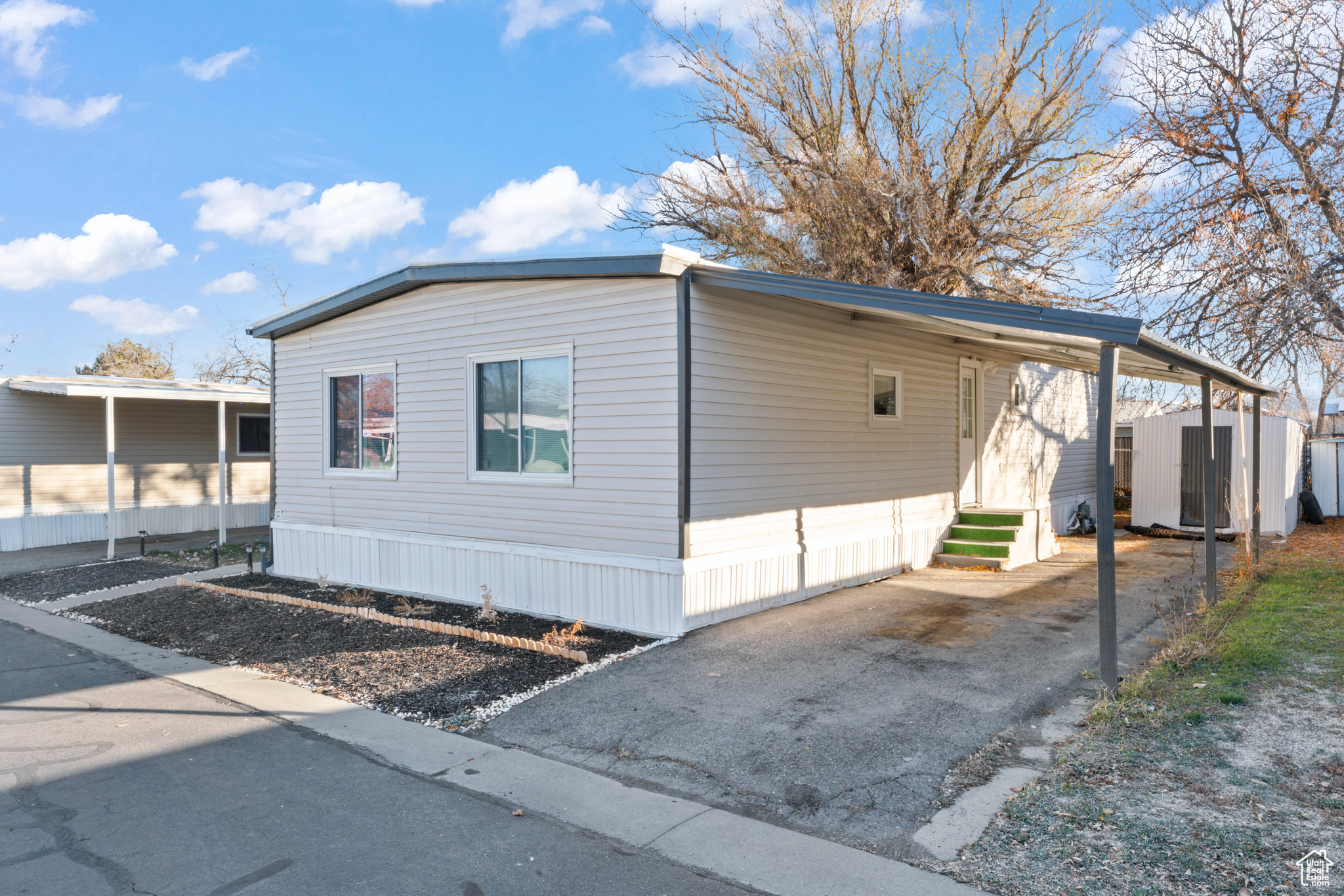 View of home's exterior with a storage unit