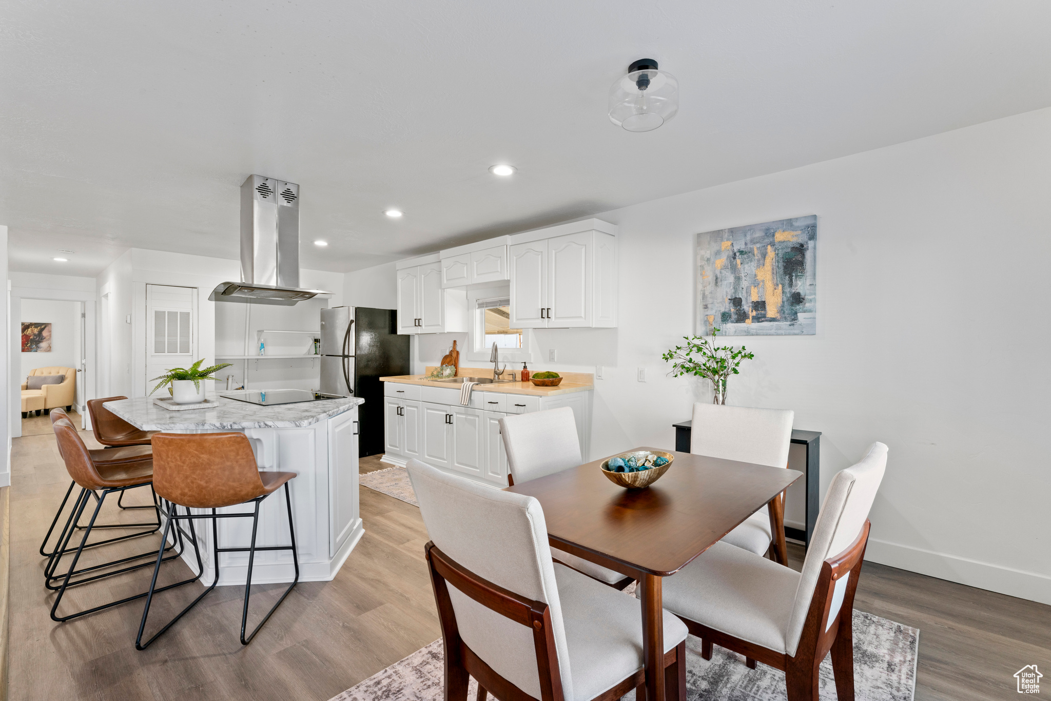 Dining area featuring light hardwood / wood-style flooring and sink