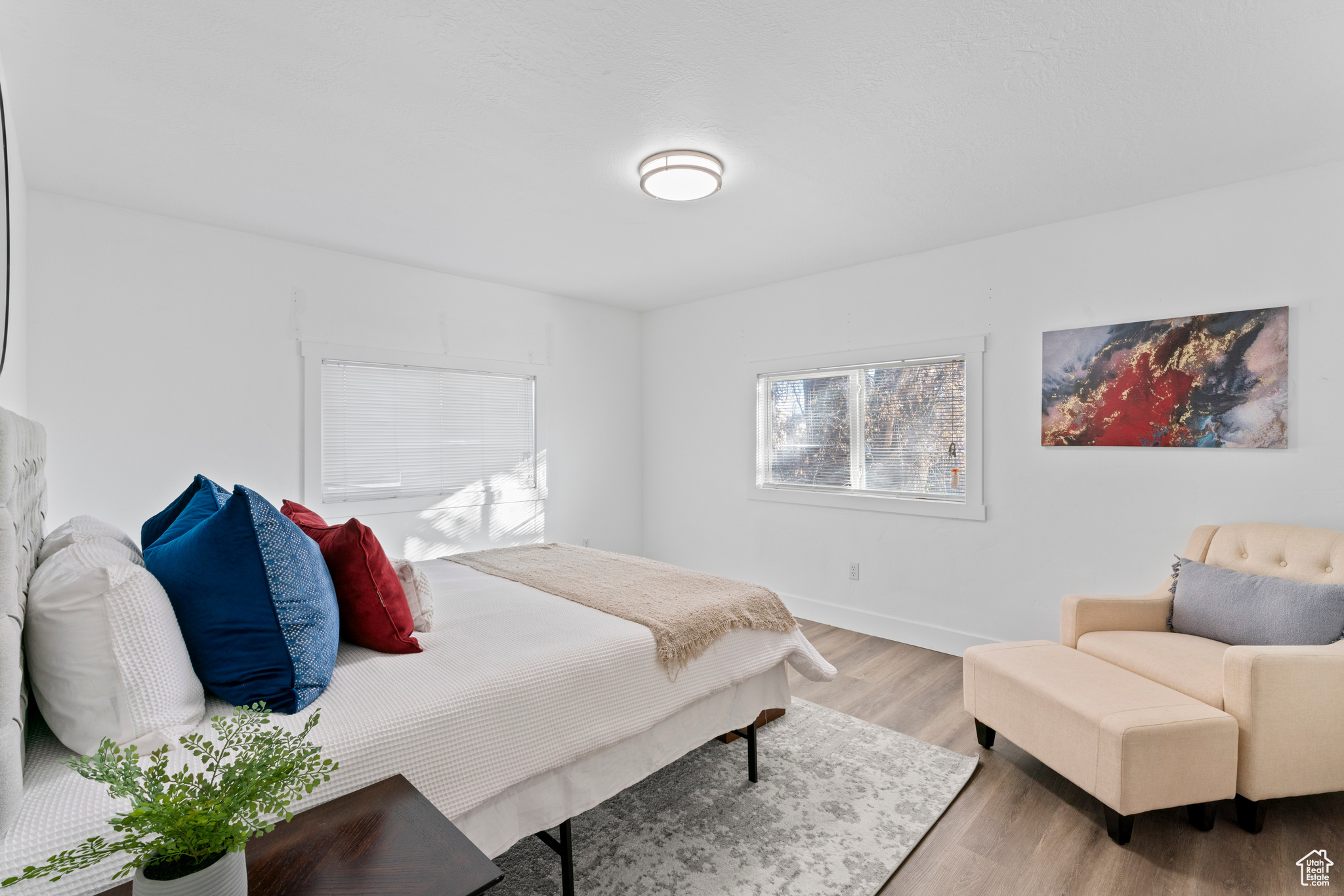 Bedroom with hardwood / wood-style flooring