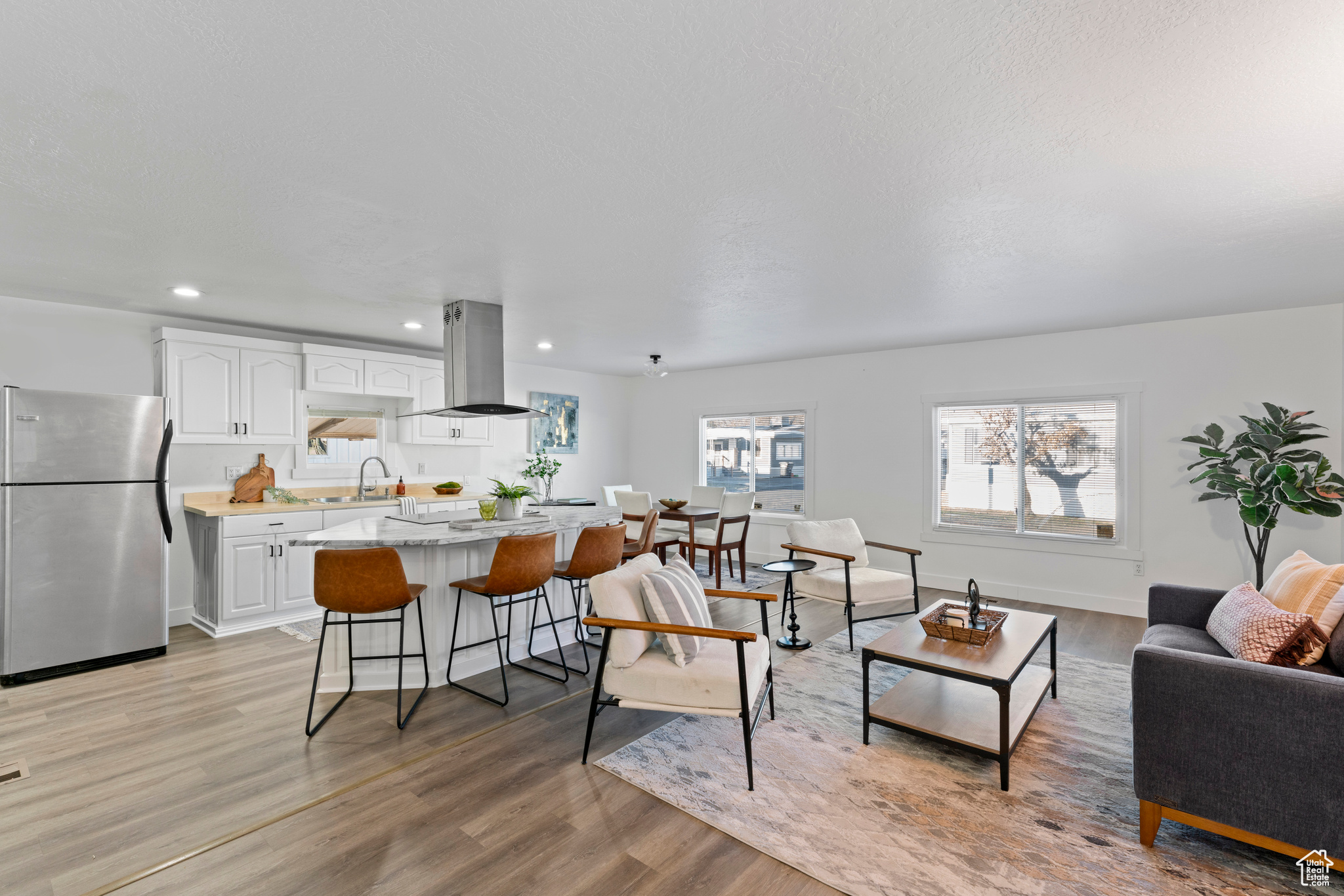 Living room featuring sink and light wood-type flooring