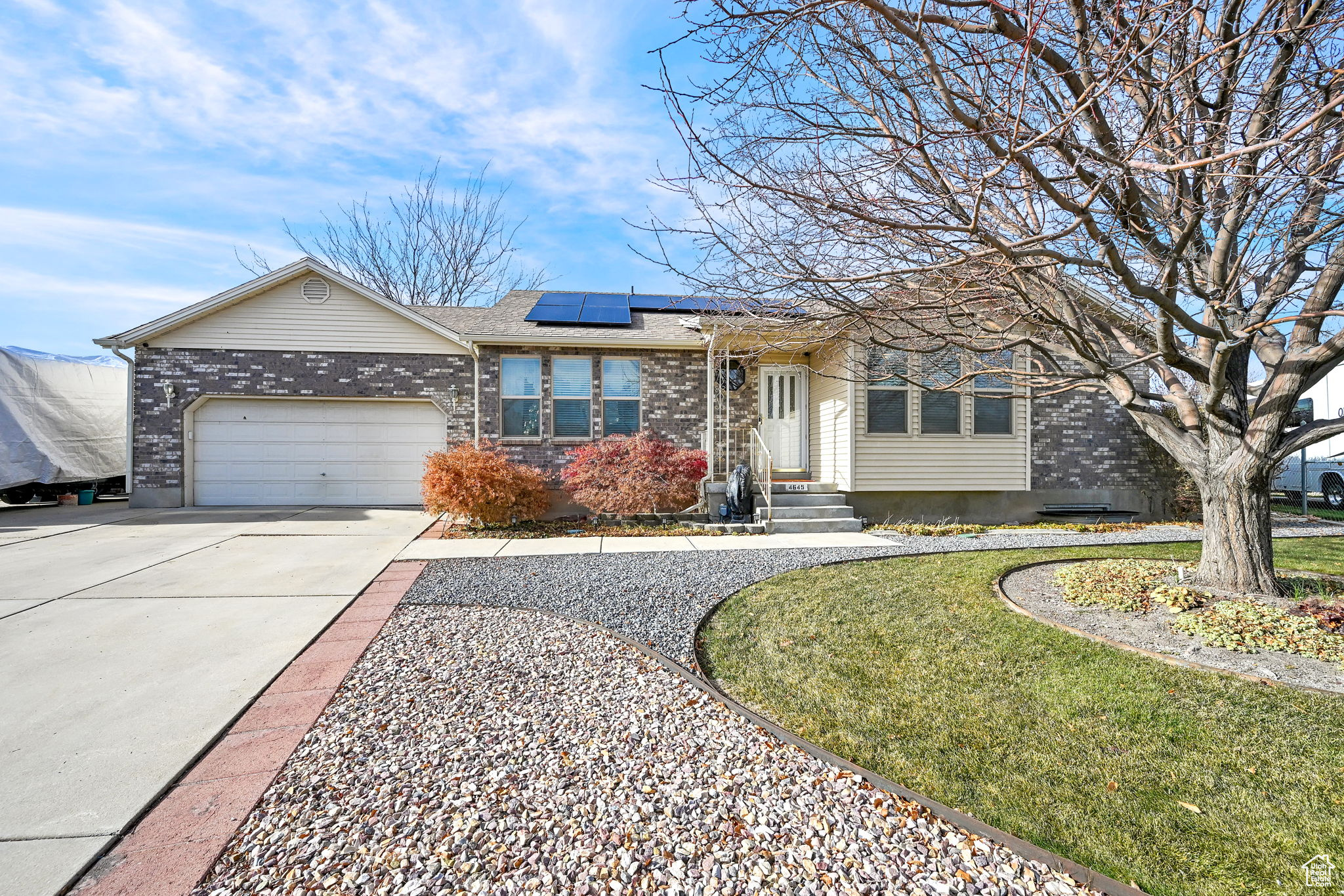 2 story rambler with solar panels, 2 car garage and RV parking