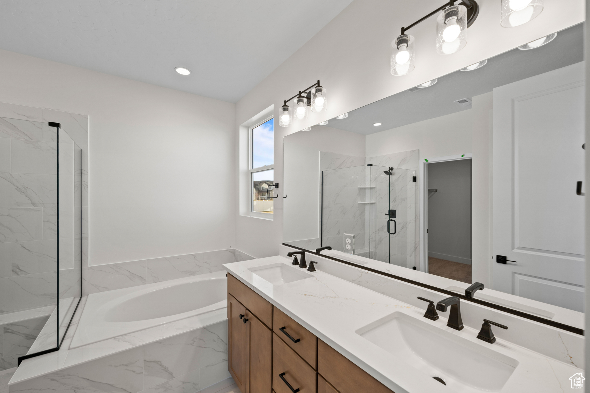 Bathroom with vanity and independent shower and bath